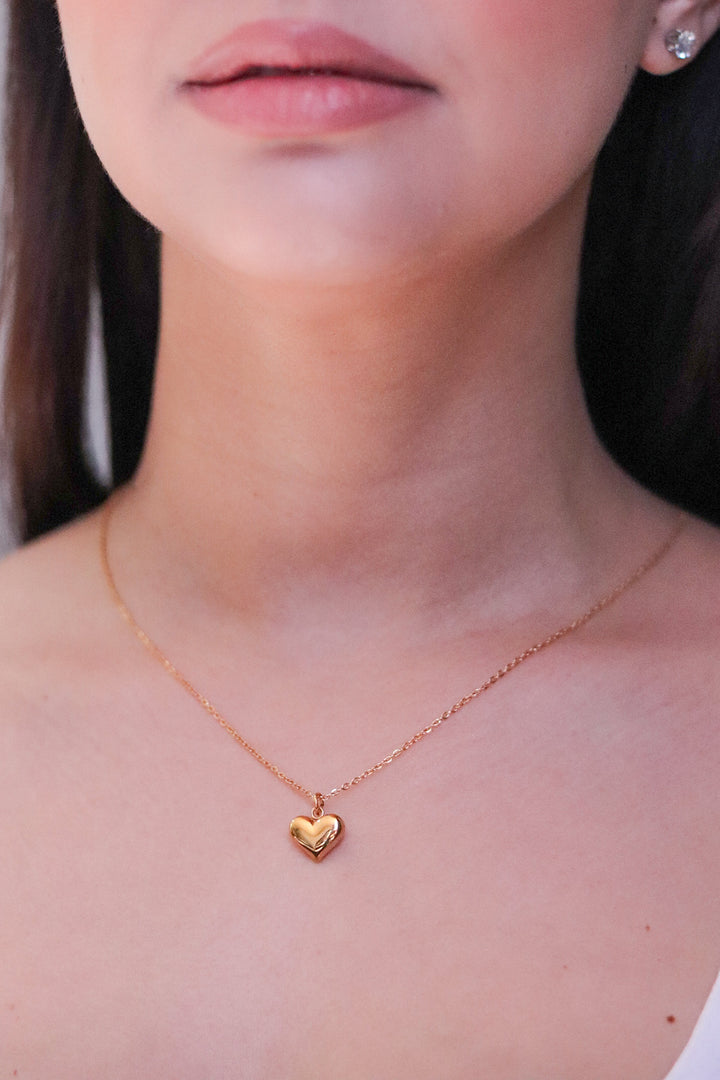 Gold Toned Necklace and Bulging Heart Pendant