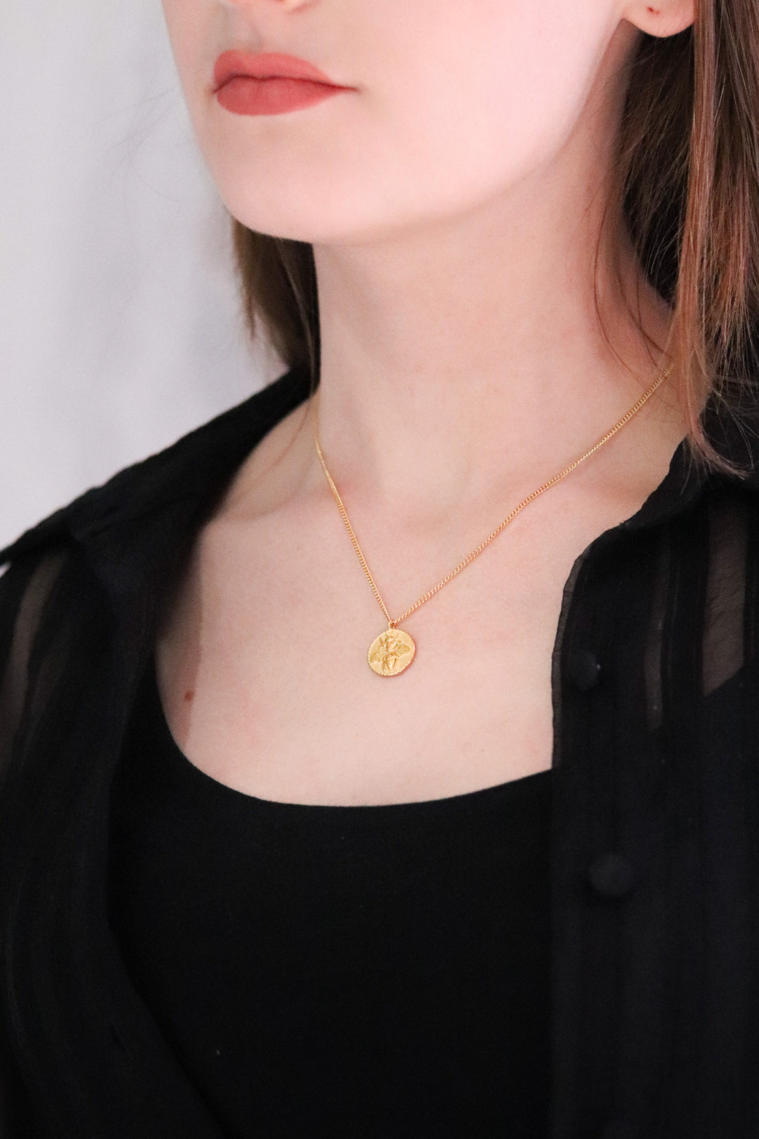 Gold Toned Necklace and Bee Disc Pendant