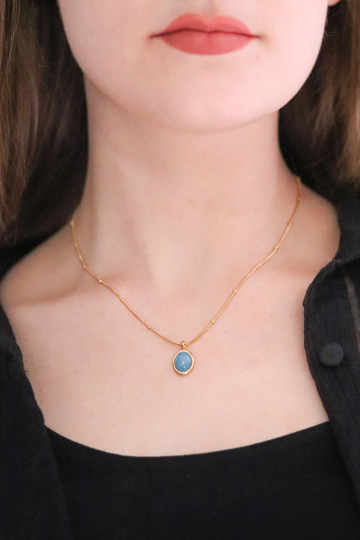 Gold Toned Snake Necklace with Blue Stone Pendant